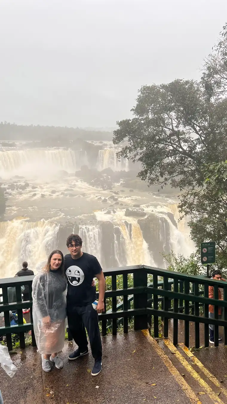 Visitors wearing rain protection at an Iguazu Falls Brazilian-side viewpoint