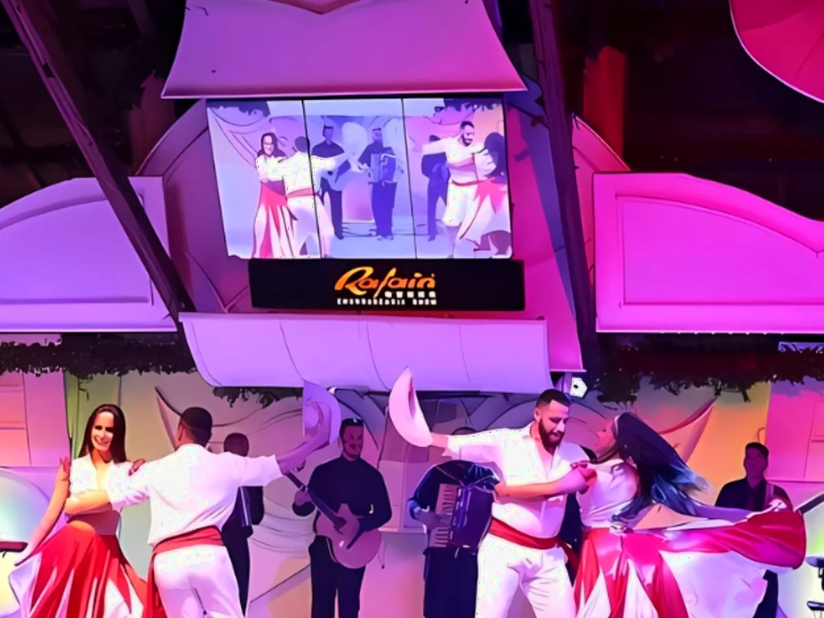 Performers on the illuminated Rafain Churrascaria Show stage